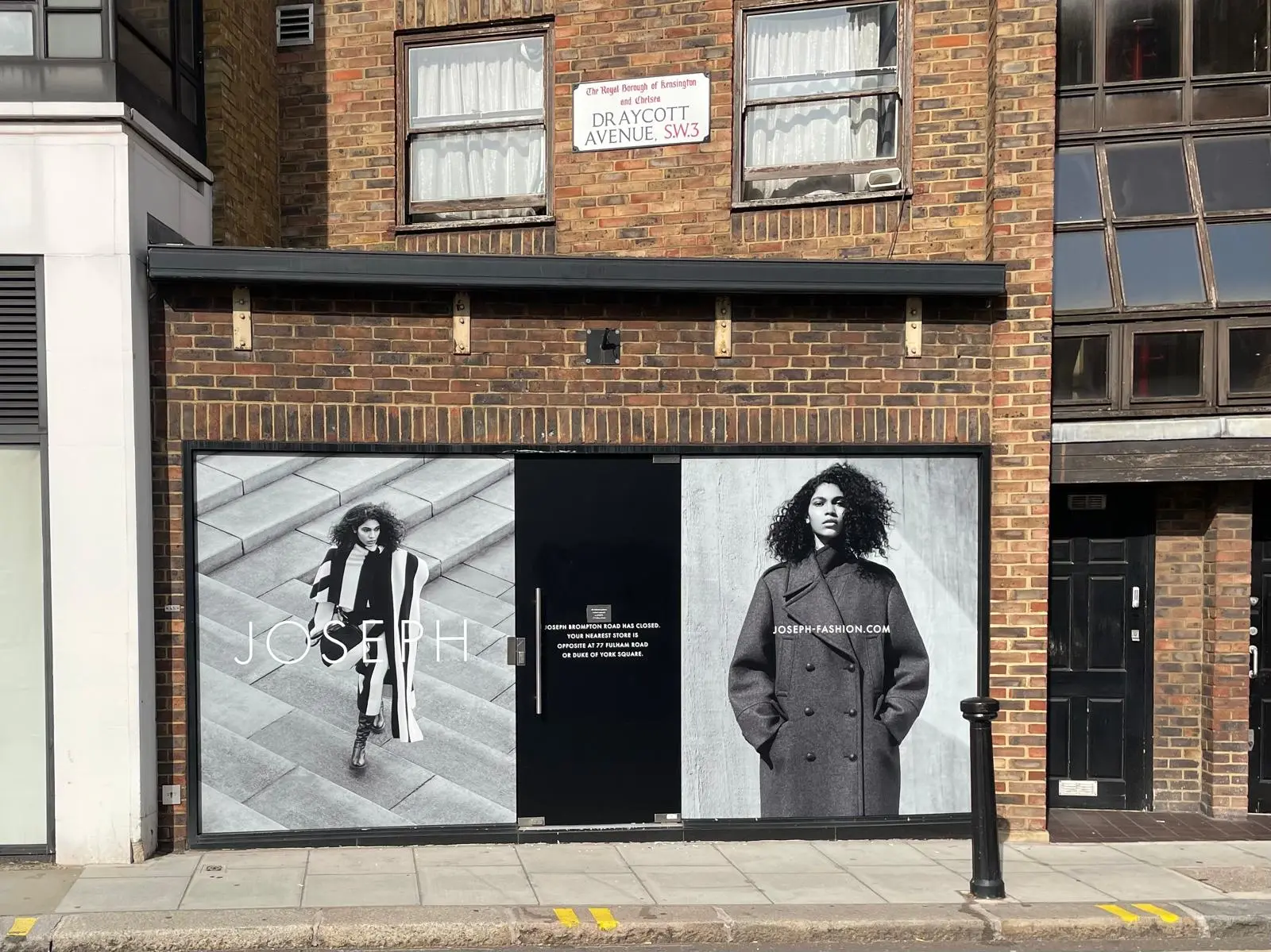 Storefront for Tobi's African Shop with large window graphics and signage.